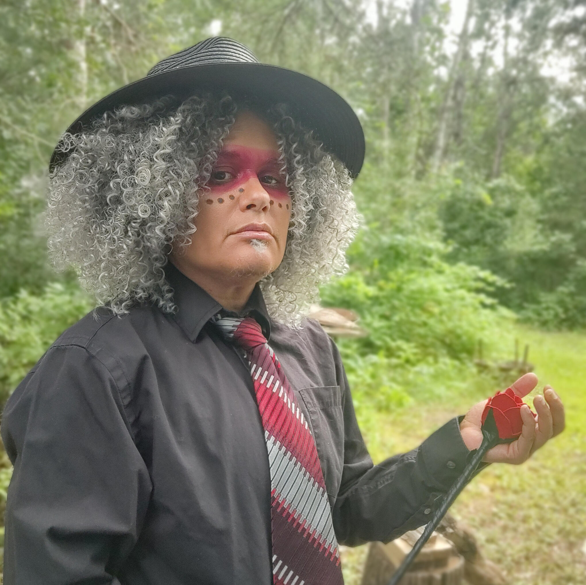 Tanamá Kao Tanamá Kao in a suit with a rose riding crop